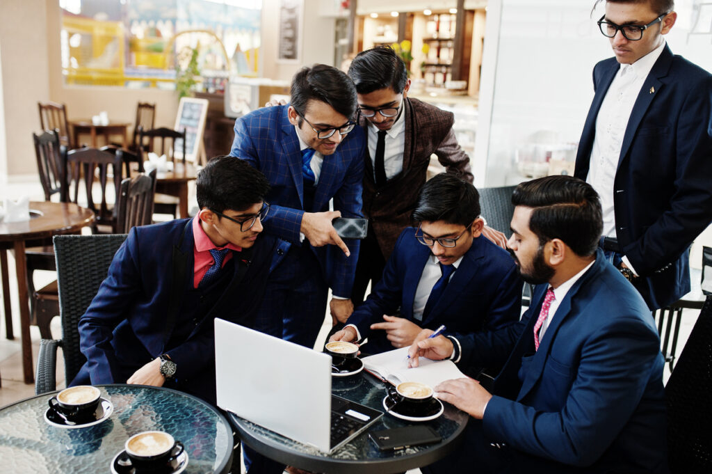Group of six indian businessman in suits